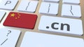 Chinese domain .cn and flag of China on the buttons on the computer keyboard. National internet related 3D rendering Royalty Free Stock Photo