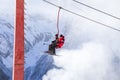 DOMBAI, RUSSIA - JANUARY 3, 2014: People are lifting on open lft high up in Caucasus mountains