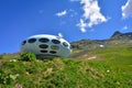 Dombay, Russia - June 11, 2022: hotel is in the form of a flying saucer on the mountain, flying saucer in the mountains, UFO in