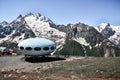 Dombay, Russia - June 11, 2022: hotel is in the form of a flying saucer on the mountain, flying saucer in the mountains, UFO in
