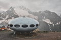 Dombay, Russia - June 09, 2022: hotel is in the form of a flying saucer on the mountain, flying saucer in the mountains, UFO in