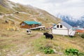 Dombay, Russia - September 2019 - view from the Mount Mussa-Achitara on hotels resort, grunting oxes and snowy peaks