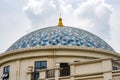 A dome blue tile gold-roofed building