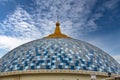 A dome blue tile gold-roofed building