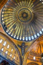 The dome of the cathedral and the six winged Seraph angel mosaic located high on the domed ceiling inside Aya Sofya, Istanbul