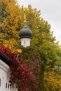 The dome of the Christian Church surrounded by autumn yellow green foliage. Beautiful facade of an orthodox orthodox church Royalty Free Stock Photo
