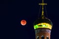 Dome of the church against the red moon. lunar eclipse Royalty Free Stock Photo