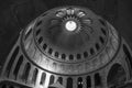 Dome in the Church of the Holy Sepulcher. The old city of Jerusalem. Black and white photo. A ray of light penetrates the temple Royalty Free Stock Photo