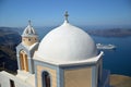 Dome of a church at Oia village with a view of Caldera in the background, Santorini island, Greece. Royalty Free Stock Photo