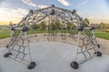 Dome climber with view of beautiful homes and sky