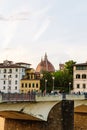 The dome of the famous Catholic Cathedral in Florence. Historic center of modern Italy and bridge over the Arno River