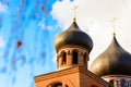 Dome with a golden cross on top of the building of the Orthodox chapel. The dome of the church. The Christian cross. Royalty Free Stock Photo