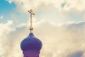 Dome with a golden cross on top of the building of the Orthodox chapel. The dome of the church. The Christian cross. Royalty Free Stock Photo