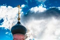 Dome with a golden cross on top of the building of the Orthodox chapel. The dome of the church. The Christian cross. Royalty Free Stock Photo