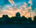 The dome of the Nurul Iman Sukra Mosque is decorated with a clear sky Royalty Free Stock Photo