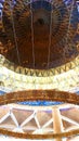 Dome and ropes hanging the ring beam support to the light bulbs inside the mosque at Riyadh airport