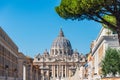 The dome of Saint Peter`s Basilica and its statues of saints at St. Peter`s Square, Vatican City Royalty Free Stock Photo