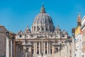 The dome of Saint Peter`s Basilica, statues of saints at St. Peter`s Square, Vatican City view from Via della Conciliazione Royalty Free Stock Photo