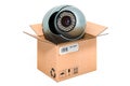 Dome security camera inside cardboard box, delivery concept. 3D rendering Royalty Free Stock Photo
