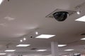 Dome security camera on top of ceiling inside Sears store Royalty Free Stock Photo