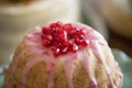 Dome shaped cake topped with pomegranate