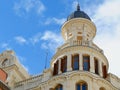 Dome on the vintage building decorated with stucco ornament and elegant balcony in Chueca district downtown Madrid, Spain