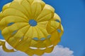 Dome of the yellow parachute on the blue sky. Royalty Free Stock Photo