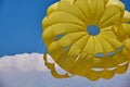 Dome of the yellow parachute on the blue sky. Royalty Free Stock Photo