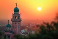 A picture of the dome and a clock tower in a Mosque at sunset or sunrise, the tallest clock tower Royalty Free Stock Photo