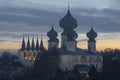 Domes and belfry of the Tikhvin Dormition Monastery at October twilight. Leningrad region, Russia Royalty Free Stock Photo