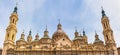 Domes with brightly colored tiles and Mudejar style towers of the basilica and cathedral of El Pilar, Zaragoza, Spain Royalty Free Stock Photo