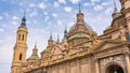 Domes with brightly colored tiles and Mudejar style towers of the basilica and cathedral of El Pilar, Zaragoza, Spain. Royalty Free Stock Photo