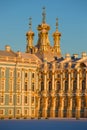 Domes of Church of the Resurrection in beams of the sunset sun. A fragment of Catherine Palace in Tsarskoye Selo, Russia Royalty Free Stock Photo