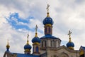 Domes of the Kislyakovskaya Church of the Nativity of the Blessed Virgin Mary against the background of a cloudy sky Royalty Free Stock Photo