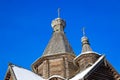 domes of an old wooden church against the background of a clear blue sky Royalty Free Stock Photo