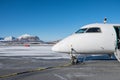 Domestic airplane refueling oil with a fuel line in station Royalty Free Stock Photo