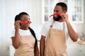 Domestic Chefs. Cheerful Black Spouses Having Fun Together In Kitchen While Cooking Royalty Free Stock Photo