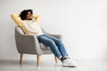 Domestic Comfort. Portrait Of Happy Black Man Relaxing In Armchair At Home Royalty Free Stock Photo