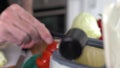 Male cook throwing organic food waste in a compost bin and pouring bokashi ferment