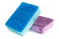 Domestic needs. Blue sponge lies on a purple sponge at a slight angle. isolate