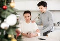 Domestic quarrel during christmas - teenage son trying to apologize to mother after domestic disagreement on christmas