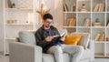 Domestic reading finished book man story sofa Royalty Free Stock Photo