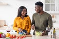 Domestic Romance. Romantic Black Couple Cooking Dinner In Kitchen And Drinking Wine Royalty Free Stock Photo