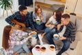 In domestic room. Group of friends have party indoors together Royalty Free Stock Photo