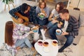 In domestic room. Group of friends have party indoors together Royalty Free Stock Photo