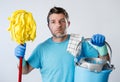 Domestic service man or stressed husband housework washing holding mop and bucket