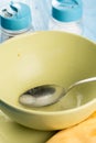 Domestic soup bowl with metal spoon on the table with selective focus Royalty Free Stock Photo