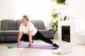 Domestic Training. Active Senior Woman Making Exersise In Front Of Laptop At Home, Free Space Royalty Free Stock Photo