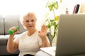 Domestic Training. Active Senior Woman Making Exersise In Front Of Laptop At Home, Free Space Royalty Free Stock Photo