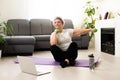Domestic Training. Active Senior Woman Making Exersise In Front Of Laptop At Home, Free Space Royalty Free Stock Photo